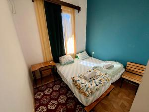 Rúm í herbergi á Bao Hostel Kutaisi