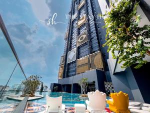 a view of a building with a table in front of it at Arte Cheras Luxury Suites by THE STAY HUB in Kuala Lumpur