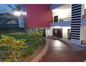 a view of a building with a walk way at HOTEL MIDTOWN INN, Singrauli in Singrauli