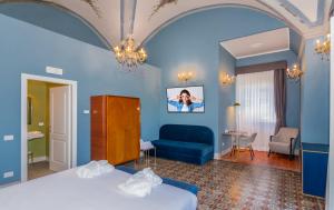 a hotel room with a bed and a couch at Hotel Villa San Michele in Lucca +65 photos