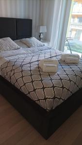 Ένα ή περισσότερα κρεβάτια σε δωμάτιο στο APARTAMENT PREMIUM V