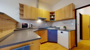 Kuchyňa alebo kuchynka v ubytovaní Apartmán Topolová 912B + 5 fotografií