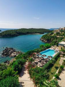 a view of a body of water with a swimming pool at Costa Smeralda in Syvota