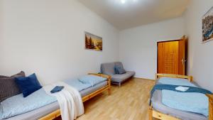 Posteľ alebo postele v izbe v ubytovaní Apartmány Topolová 909B velký