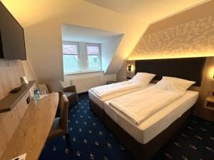 Postel nebo postele na pokoji v ubytování Hotel Gasthof zur Heinzebank