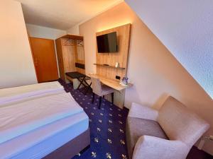 Postel nebo postele na pokoji v ubytování Hotel Gasthof zur Heinzebank