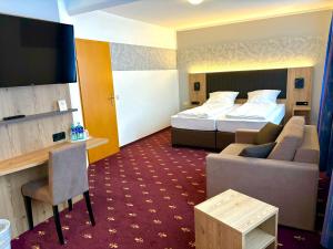 Postel nebo postele na pokoji v ubytování Hotel Gasthof zur Heinzebank