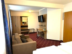 TV a/nebo společenská místnost v ubytování Hotel Gasthof zur Heinzebank