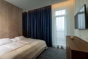 Postel nebo postele na pokoji v ubytování Hotel Tatra