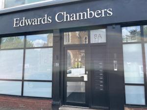 a store front with a sign that reads evanguard cleaners at BL 1 Bedroom Apartment, Town Centre, Secure gated parking option, Modern, fresh and spacious living, Netflix ready TV, Wifi in Wellingborough