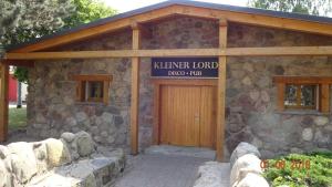 a small stone building with a sign on it at Ferienhaus Sylvia in Basedow in Basedow +20 photos