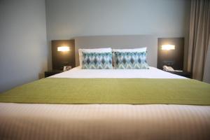Vuode tai vuoteita majoituspaikassa Aranjuez Hotel & Suites