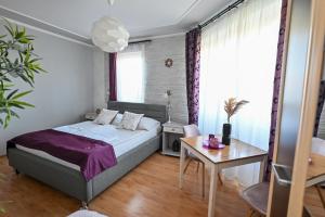 Posteľ alebo postele v izbe v ubytovaní BellaVista 2 Apartman