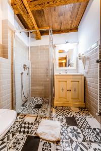 a bathroom with a shower and a sink at CASA CHITIC - HOTEL & RESTAURANT- Str Nicolae Balcescu 13 in Braşov