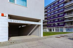 a parking garage in front of a building at HM - Ocean Breeze Delight in Matosinhos