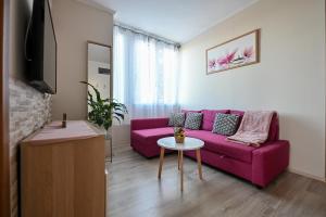 Televízia a/alebo spoločenská miestnosť v ubytovaní BellaVista 2 Apartman