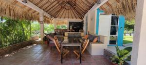 an outdoor dining area with a table and chairs at OCEAN OASIS HOTEL - adult only, four casitas boutique resort in Playa Agua Blanca