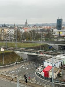 a bridge over a highway in a city at Sky Apartments 506 in Plzeň