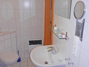 a bathroom with a sink and a toilet at FLOATING HOUSES Classic _ _Schwimm in Barth