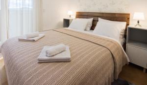 Una cama o camas en una habitación de Apartman Mima Divcibare