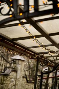 a string of lights hanging from awning at Петрос Family Hotel in Yaremche