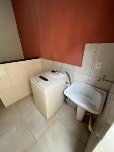 a small bathroom with a toilet and a bidet at La Palma Hotel Fazenda in Indaiatuba