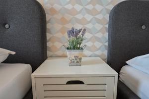 Posteľ alebo postele v izbe v ubytovaní BellaVista 1 Apartman
