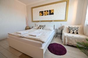Posteľ alebo postele v izbe v ubytovaní BellaVista 1 Apartman