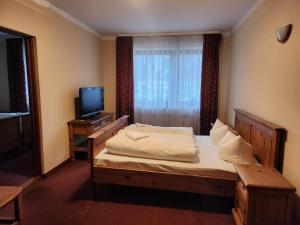 Postel nebo postele na pokoji v ubytování Mamma Mia - pokoje gościnne + 9 fotografií