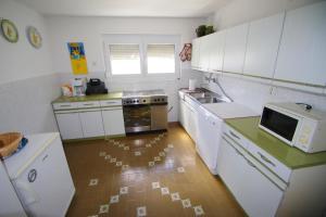 Kuchyň nebo kuchyňský kout v ubytování Holiday House Jasna