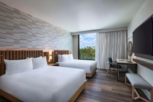 Voodi või voodid majutusasutuse Hyatt Regency Conroe toas