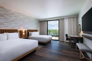 Voodi või voodid majutusasutuse Hyatt Regency Conroe toas