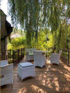a patio with a table and chairs under a tree at rheinhessen-landhaus in Tiefenthal