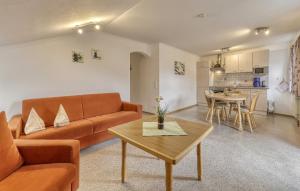 a living room with a couch and a table at Erlebnishof Reiner - Urlaub auf dem Bauernhof in Sankt Englmar