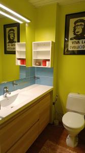 a bathroom with a white sink and a toilet at Aurinko in Varkaus