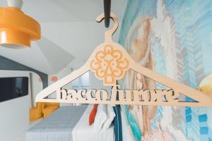 a hanger with the word margarita hanging in a room at Albergo Dipinto BaccoFurore in Furore
