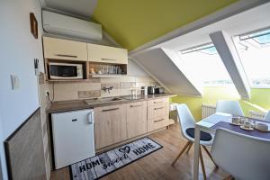 Kuchyňa alebo kuchynka v ubytovaní BellaVista 1 Apartman