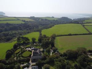 an aerial view of a house in a green field at Crugsillick Studio in Veryan
