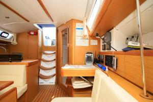 a small room with a kitchen in a boat at Salis - Jeanneau 39i in Lisbon