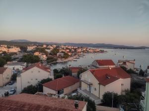 a view of a town and a body of water at Apartment Tomi in Brodarica
