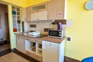 Kuchyňa alebo kuchynka v ubytovaní BellaVista 1 Apartman