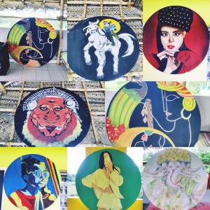 a collage of pictures with paintings of women at WoodPacker Hostel Auroville Pondicherry in Auroville
