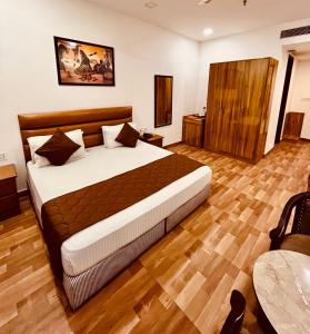 Postel nebo postele na pokoji v ubytování Amora Rooms Dwarka