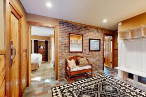 a living room with a brick wall at The Nest in Irasville +54 photos