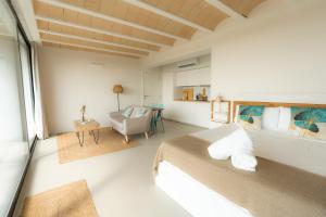 a bedroom with a large bed and a desk at Estrellas de Gredos in Arenas de San Pedro