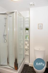 a bathroom with a shower and a toilet at 4 Br 3 Bathroom City Centre Free Parking in Southampton