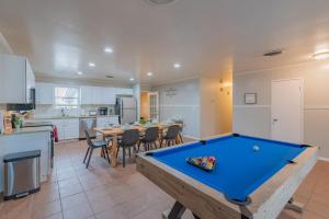 a kitchen with a pool table in a room at Texas Vacation Home, Game Room & Pool By Sixflags in San Antonio