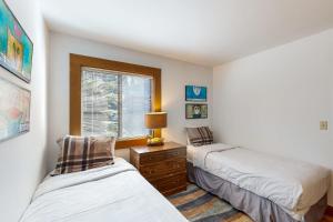 a bedroom with two beds and a window at Great Northstar Condo in Kingswood Estates