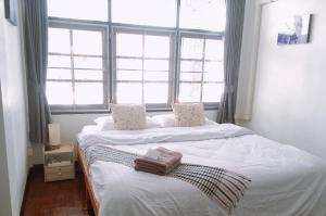 Tempat tidur dalam kamar di Wayside Guesthouse