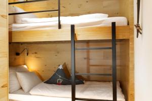 a bunk bed room with two bunk beds at Heimat 1495m Appartement TYP 3 in Schröcken